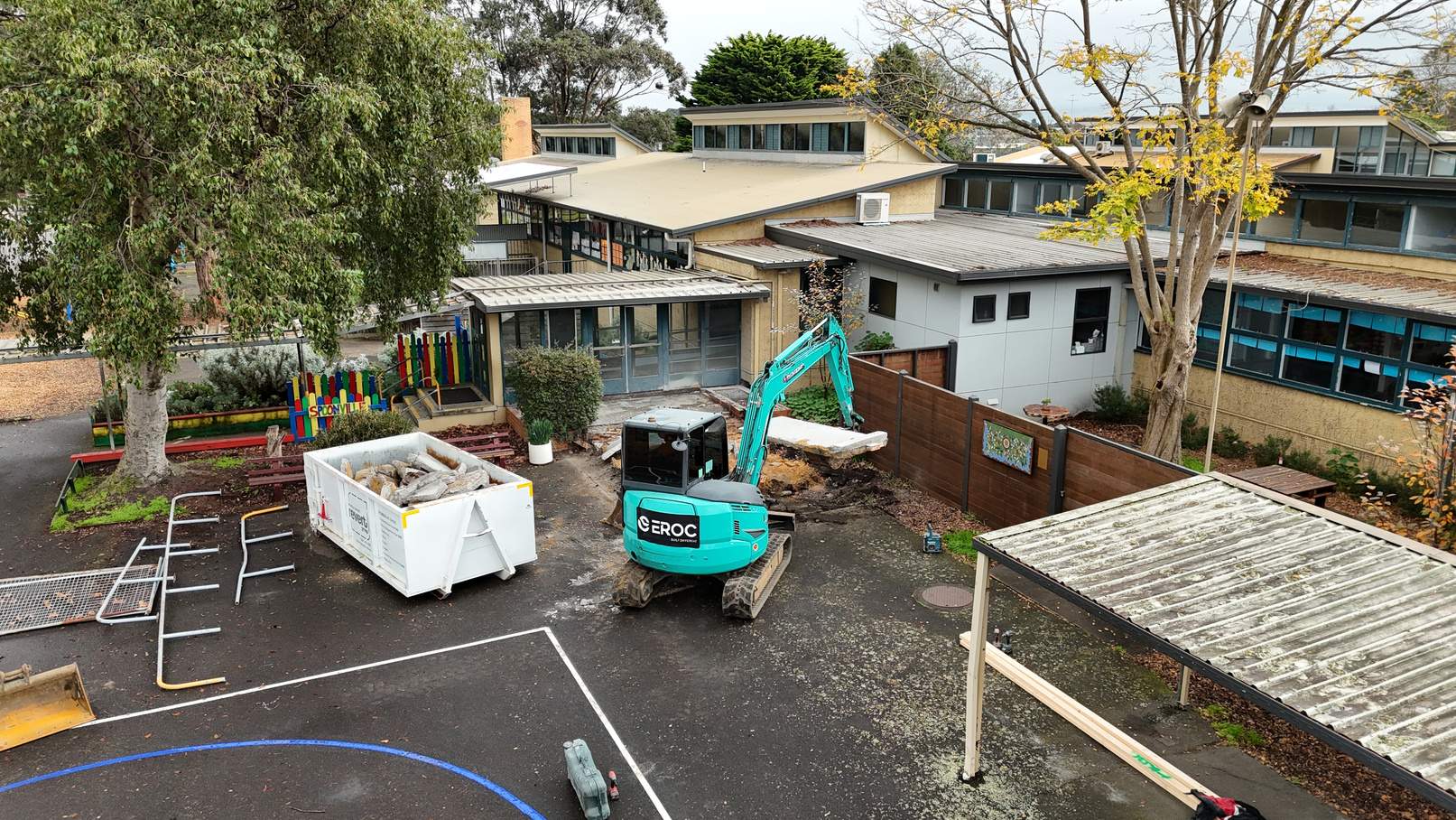 EROC excavator working inside the live Newborough Primary School site